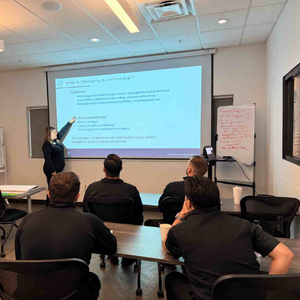 Dana Wines leading employee training at We Auto Dana Wines leading employee training at We Auto