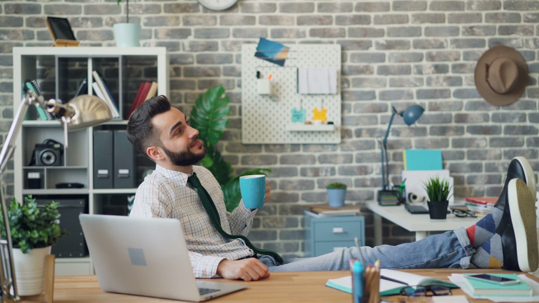 Entrepreneur working confidently in a bright workspace after exercise, coffee, or a healthy morning routine.