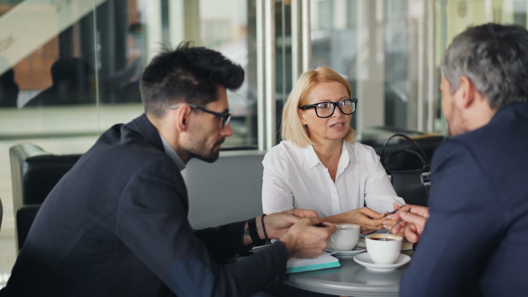 Agent reassuring clients during a challenging conversation or reviewing offers together.
