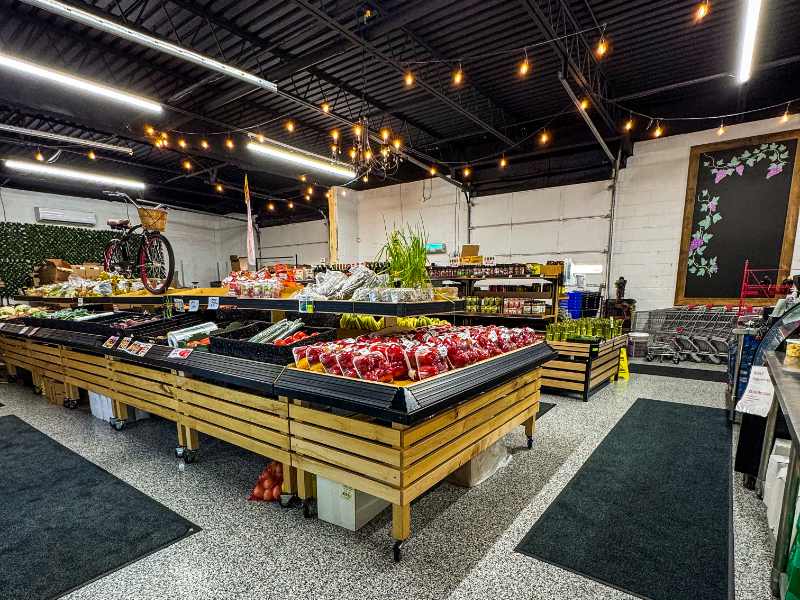 Warehouse Produce Depot store floor in Chatham — produce bins and shelves open to the public