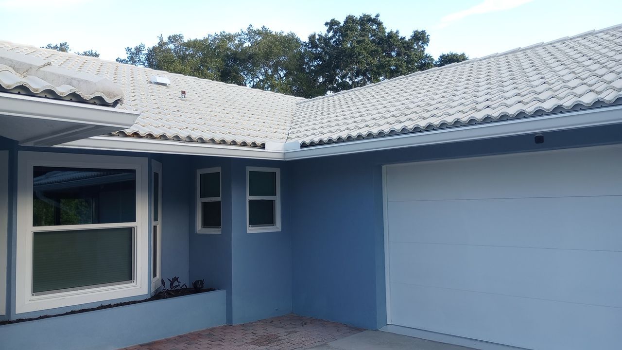 Professional roofer installing and repairing residential and commercial roofs