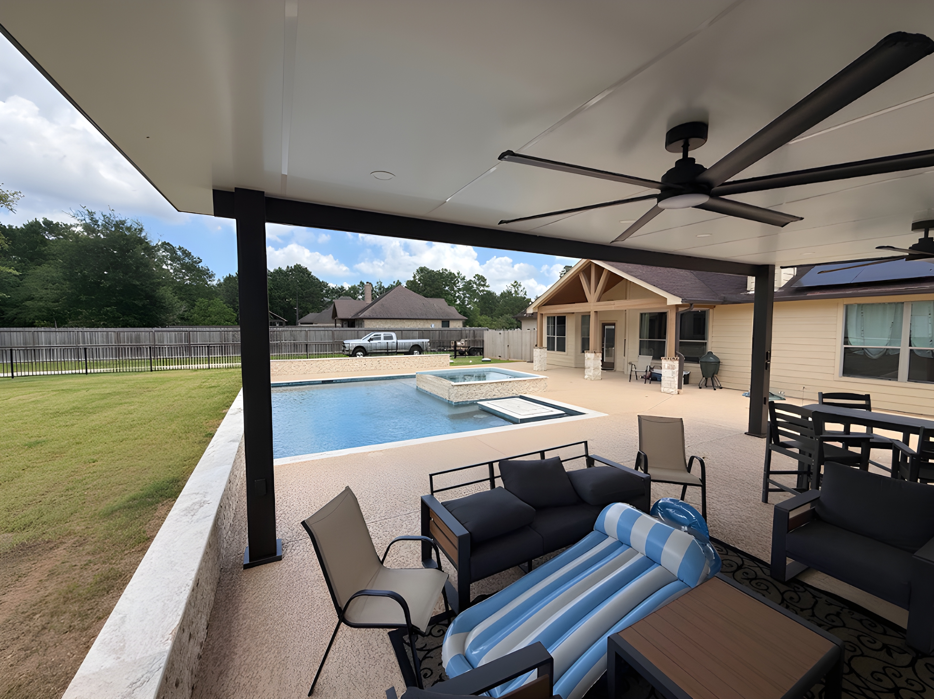 Custom pool with integrated spa and water feature