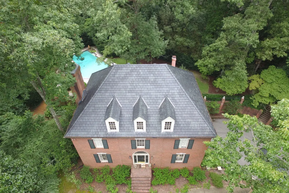 Brava synthetic slate roof on a brick colonial with dormer windows