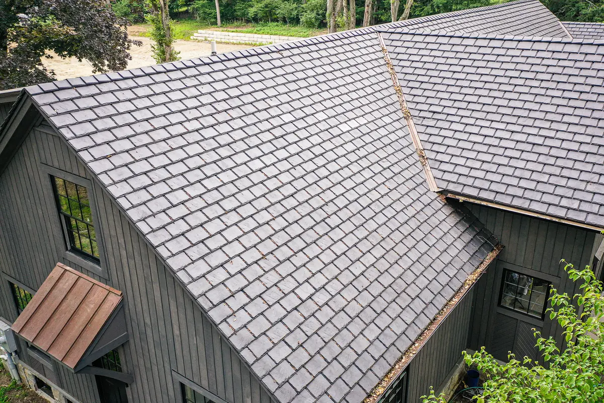 Close three-quarter view of Brava synthetic slate coursing across a gable