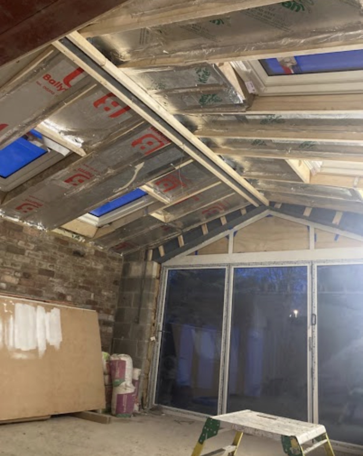 Finished interior space with smooth walls and ceiling by Elite Plastering Contractors Ltd