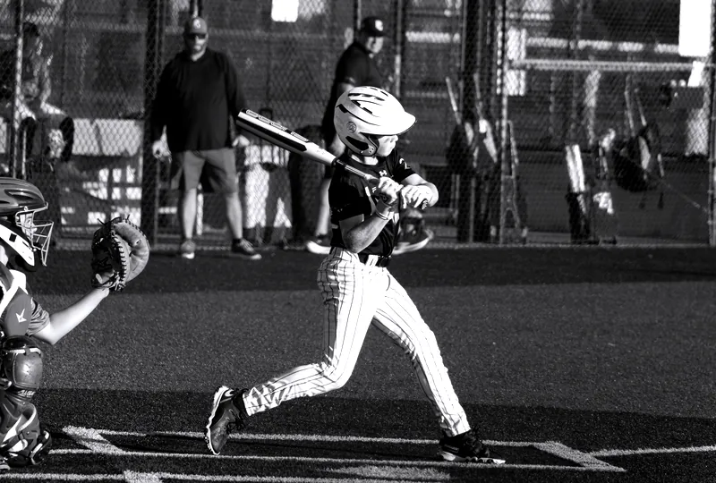 A Florida Hype batter finishes his swing