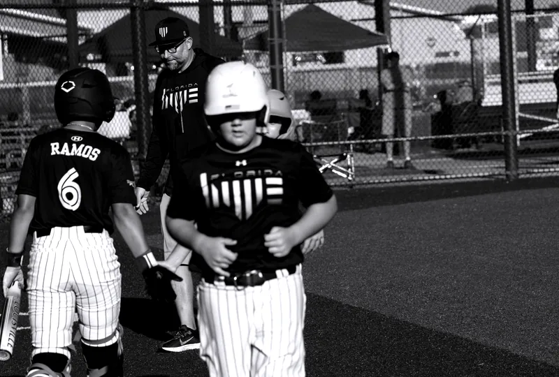 Isaiah Ramos crosses the plate with a teammate