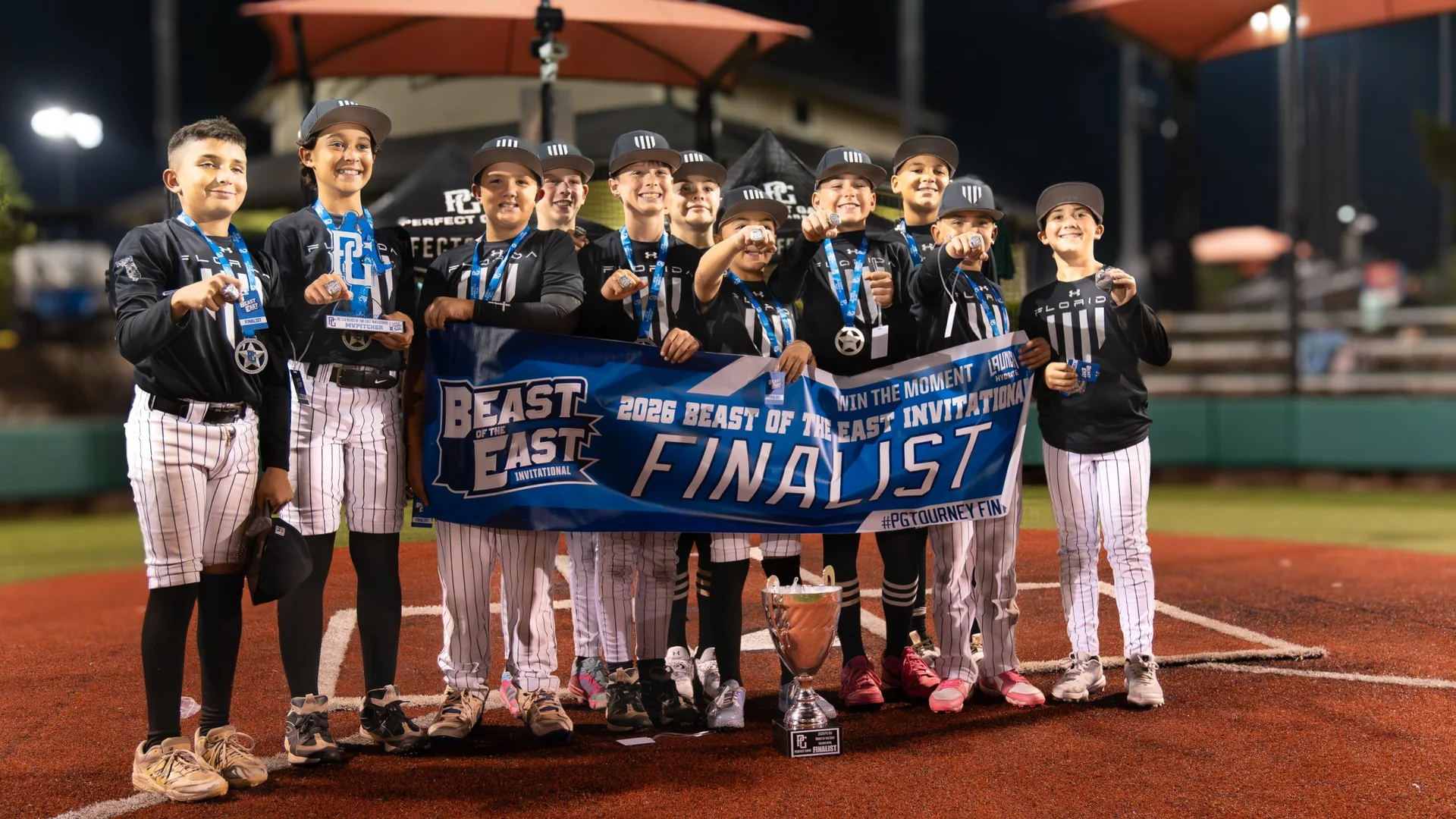 Florida Hype 11U holding the 2026 PG Beast of the East Invitational finalist banner, October 2026