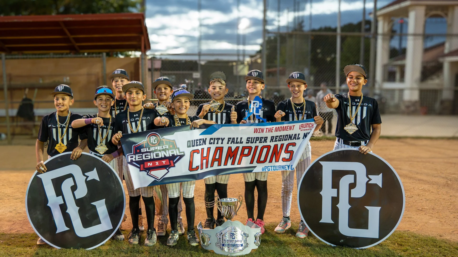 Florida Hype 11U holding the 2026 PG Queen City Fall Super Regional NIT championship banner, October 2026