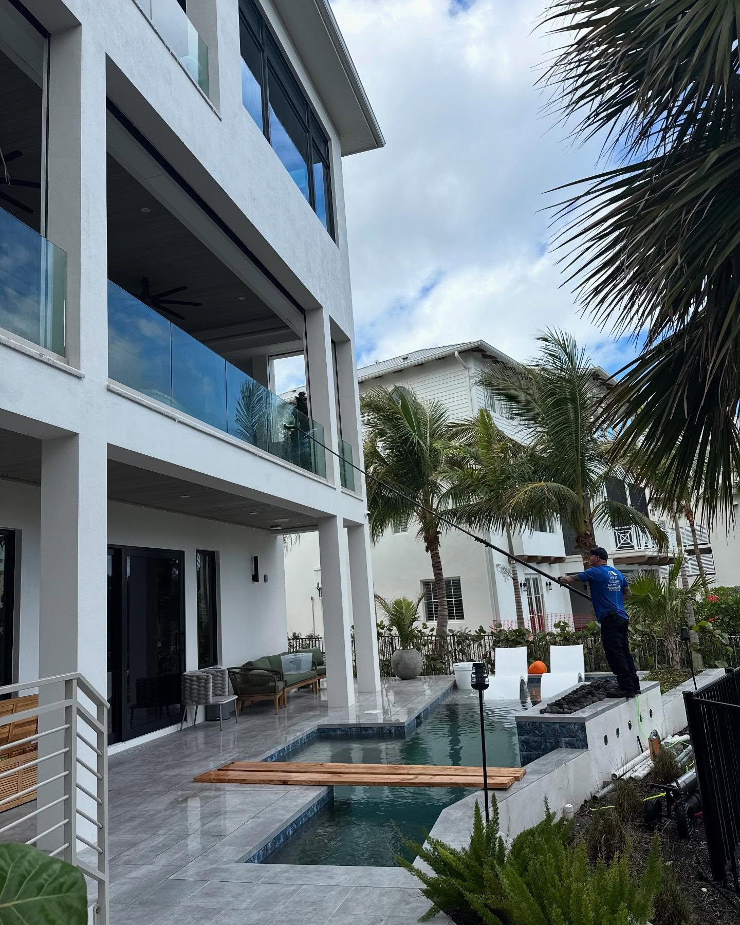 B&B Exterior Services cleaning exterior glass on a Southwest Florida home