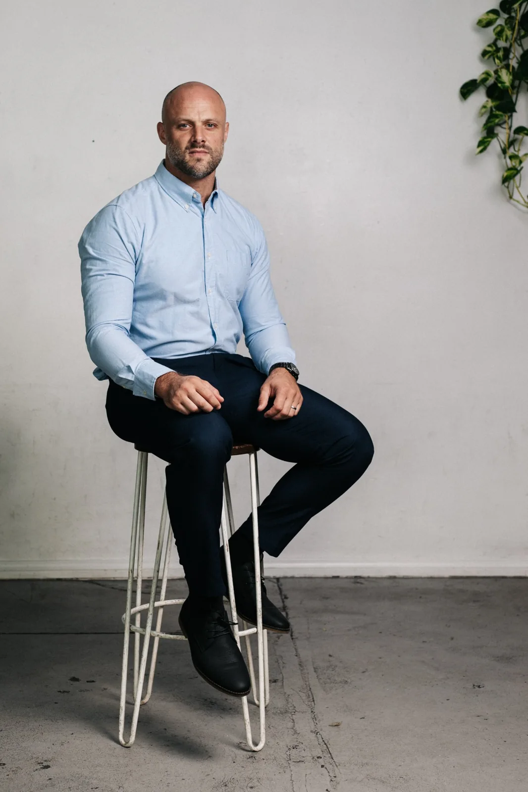 Portrait of Martin McPhilimey wearing a light blue shirt