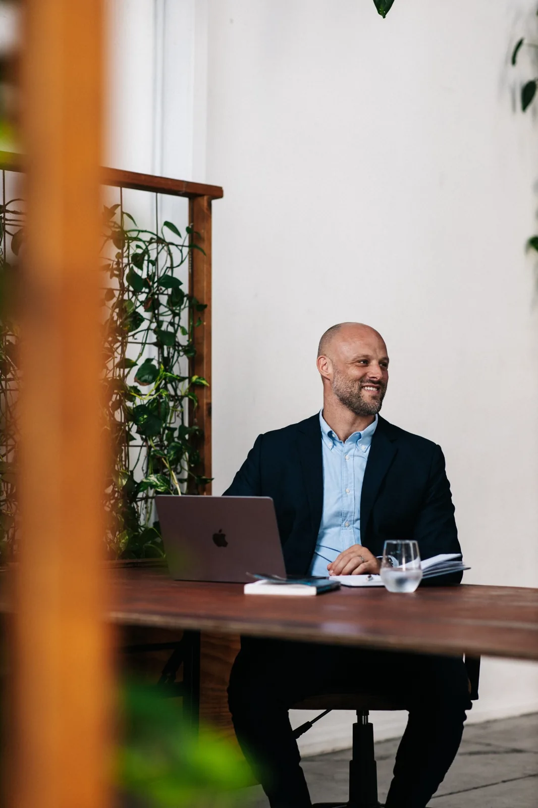 Martin seated in a professional meeting setting