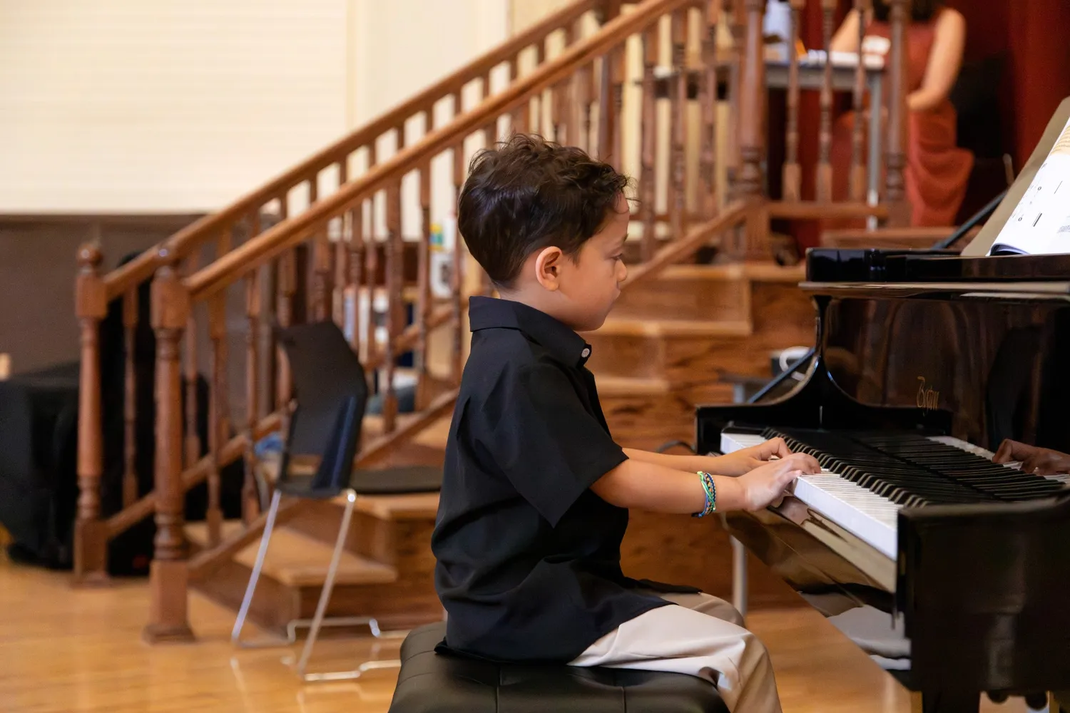 Student performing music at a Musicolor recital