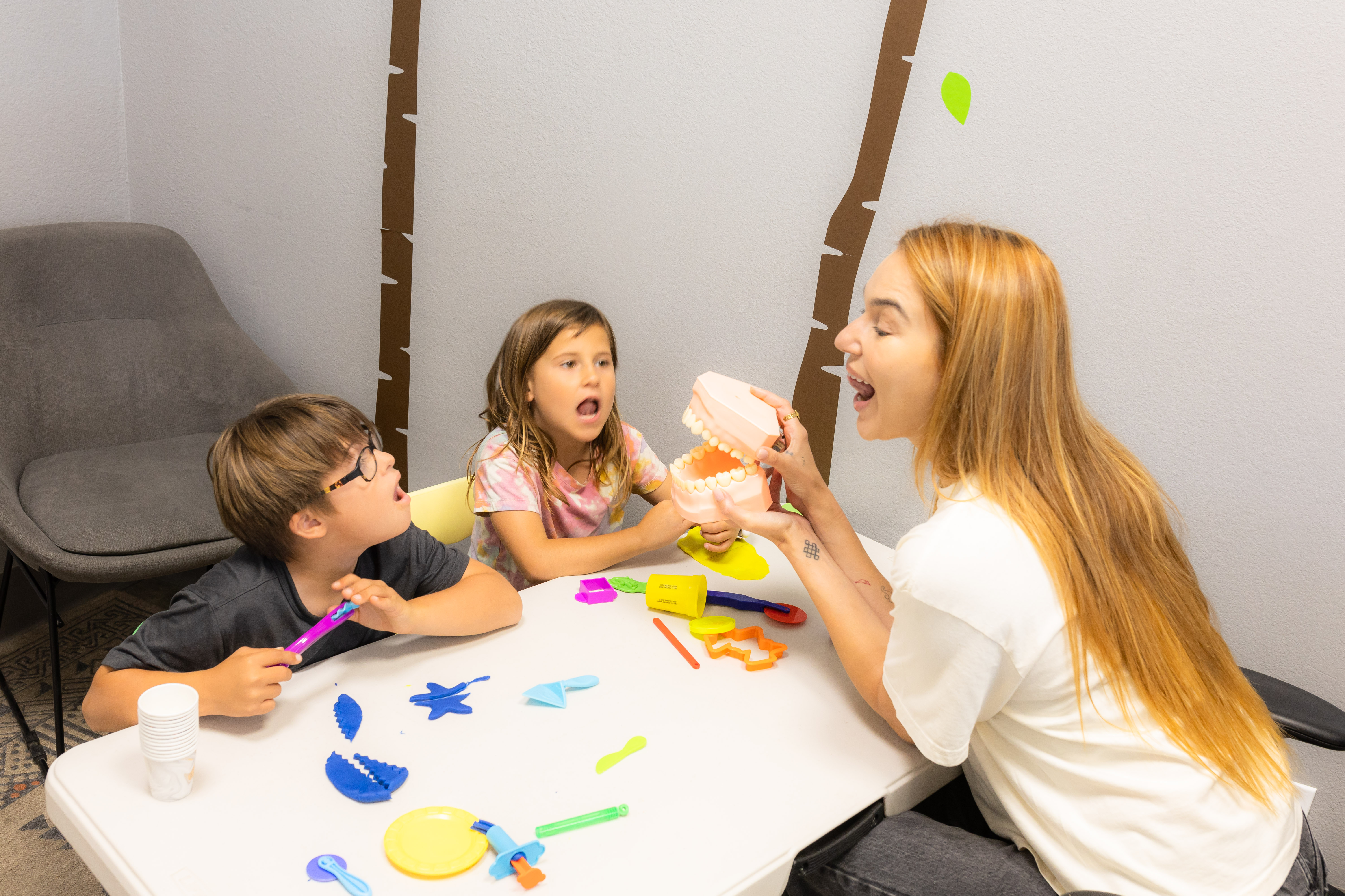 Speech therapist helping a child develop communication skills