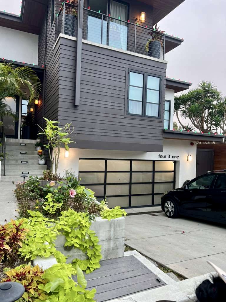 Modern exterior repaint with dark siding