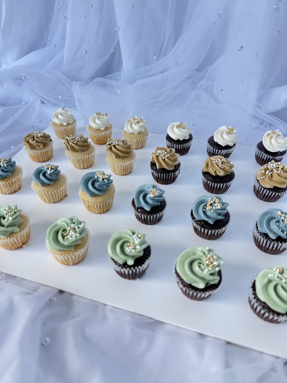 Custom cupcakes styled to theme