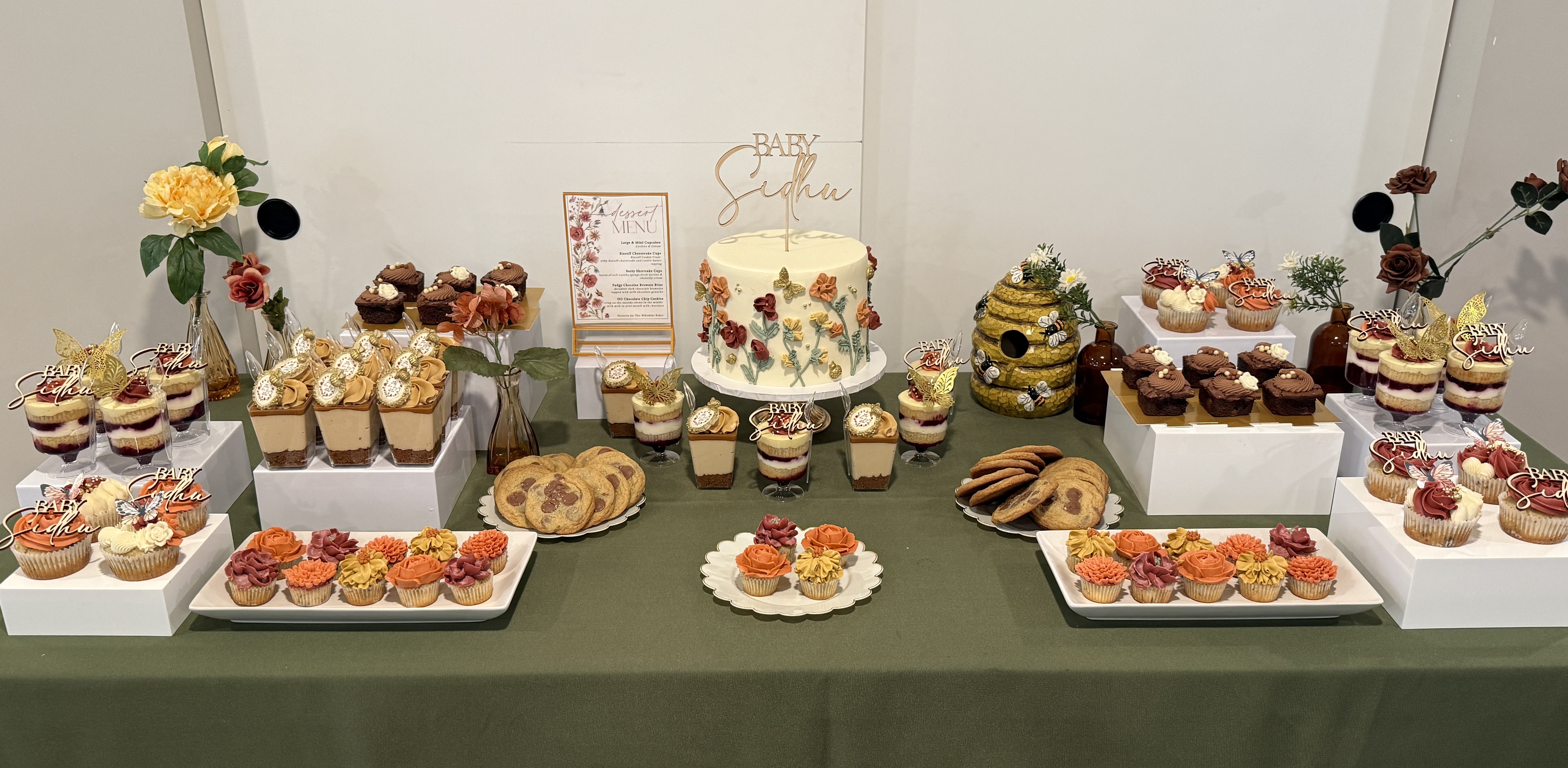 Baby shower dessert table in Vancouver with custom cookies and cupcakes