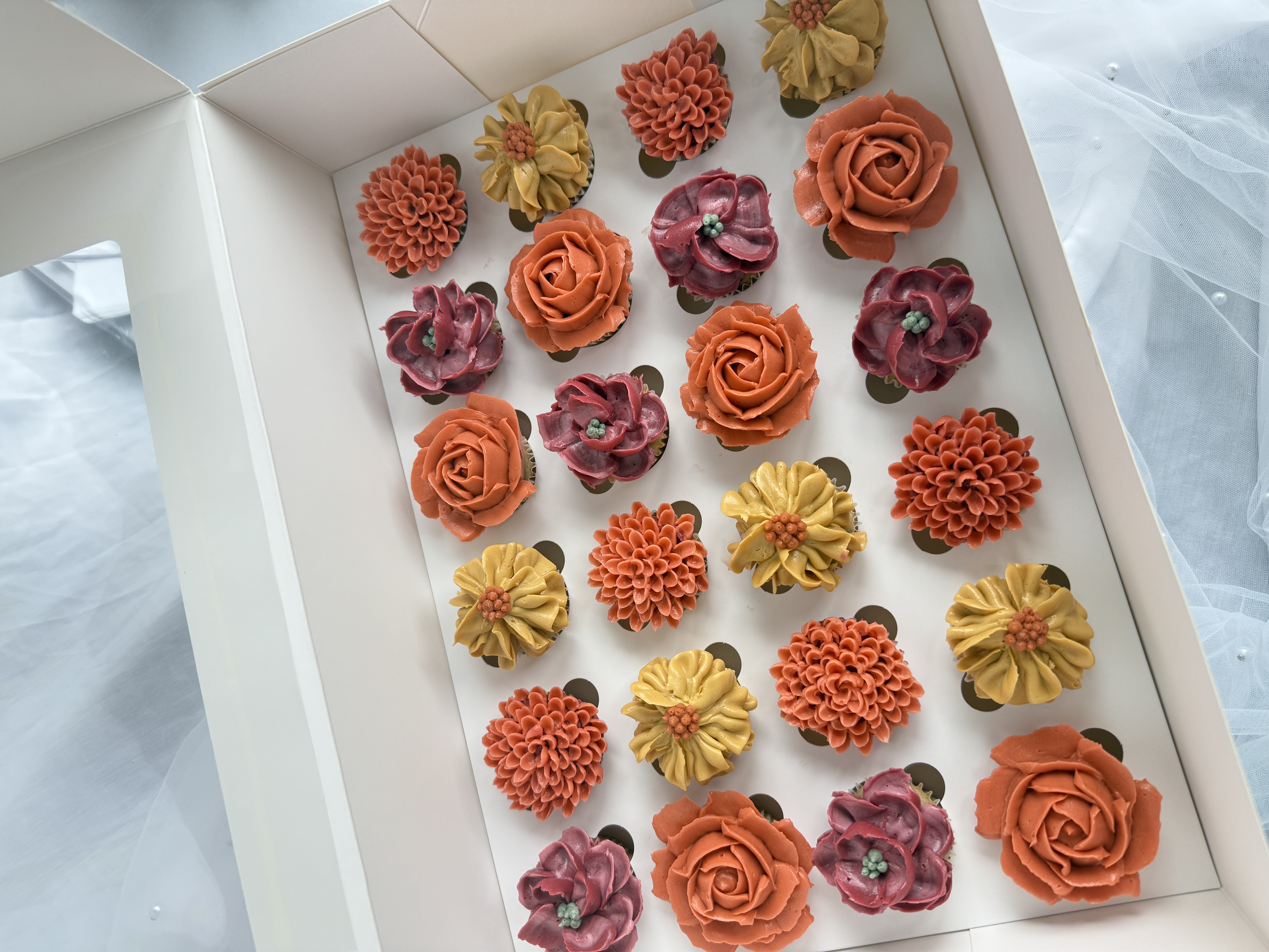 Decorated cupcakes on a dessert bar