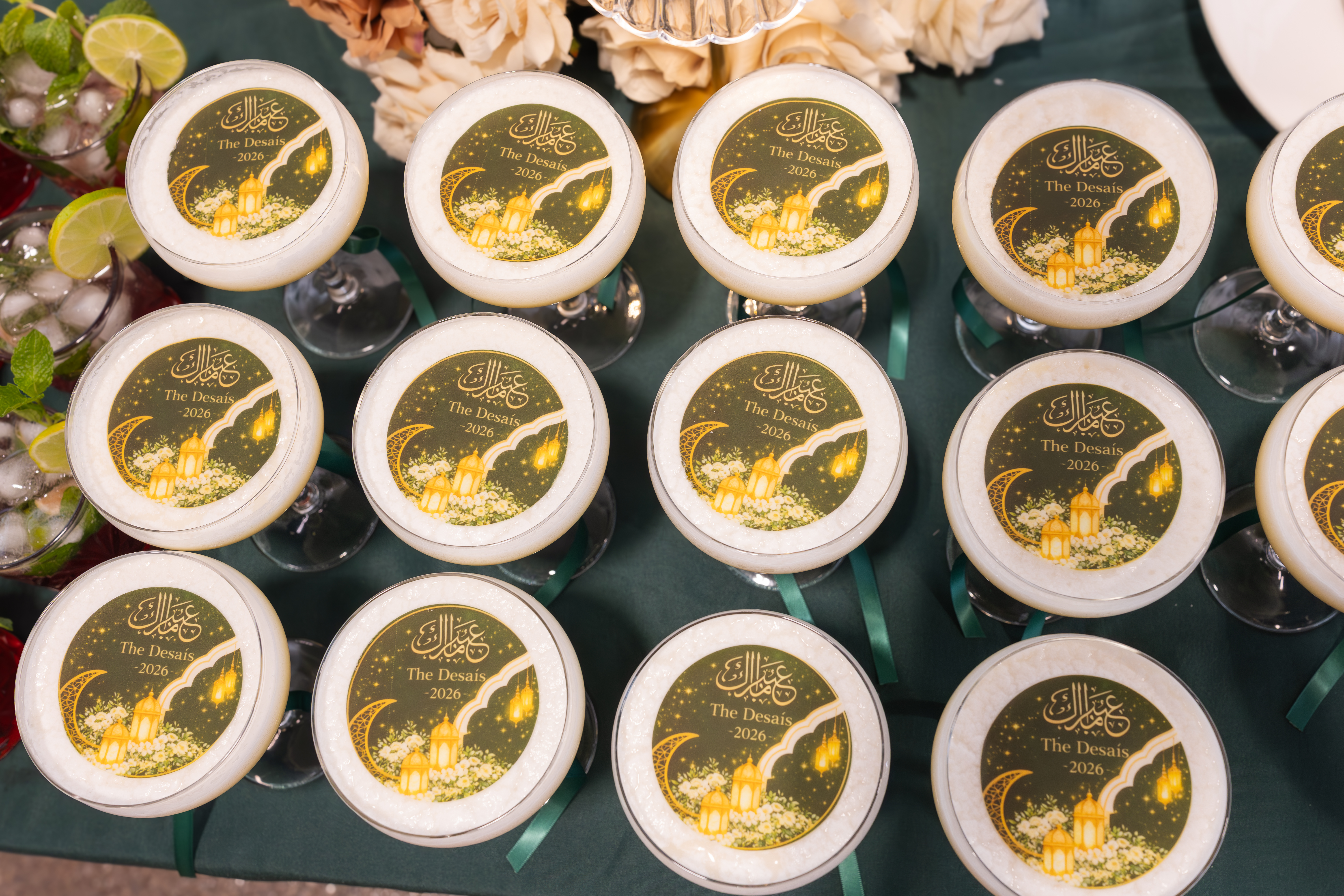 Custom gold edible drink toppers floating on cocktail glasses