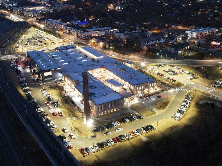 Aerial view of a restored mill in NoDa, Charlotte, at night