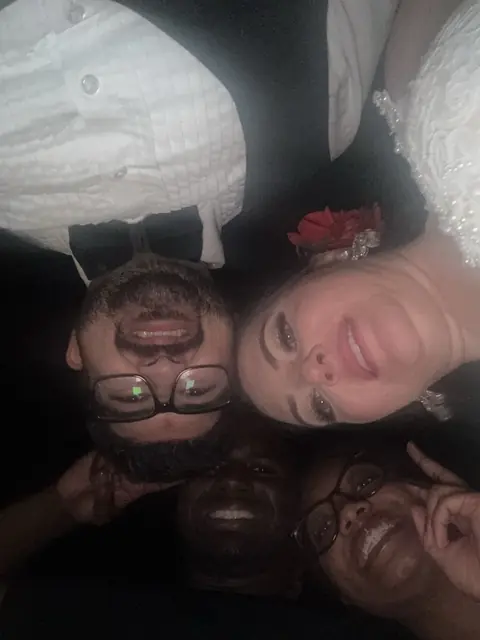 David and Mycheal taking a selfie with newlyweds