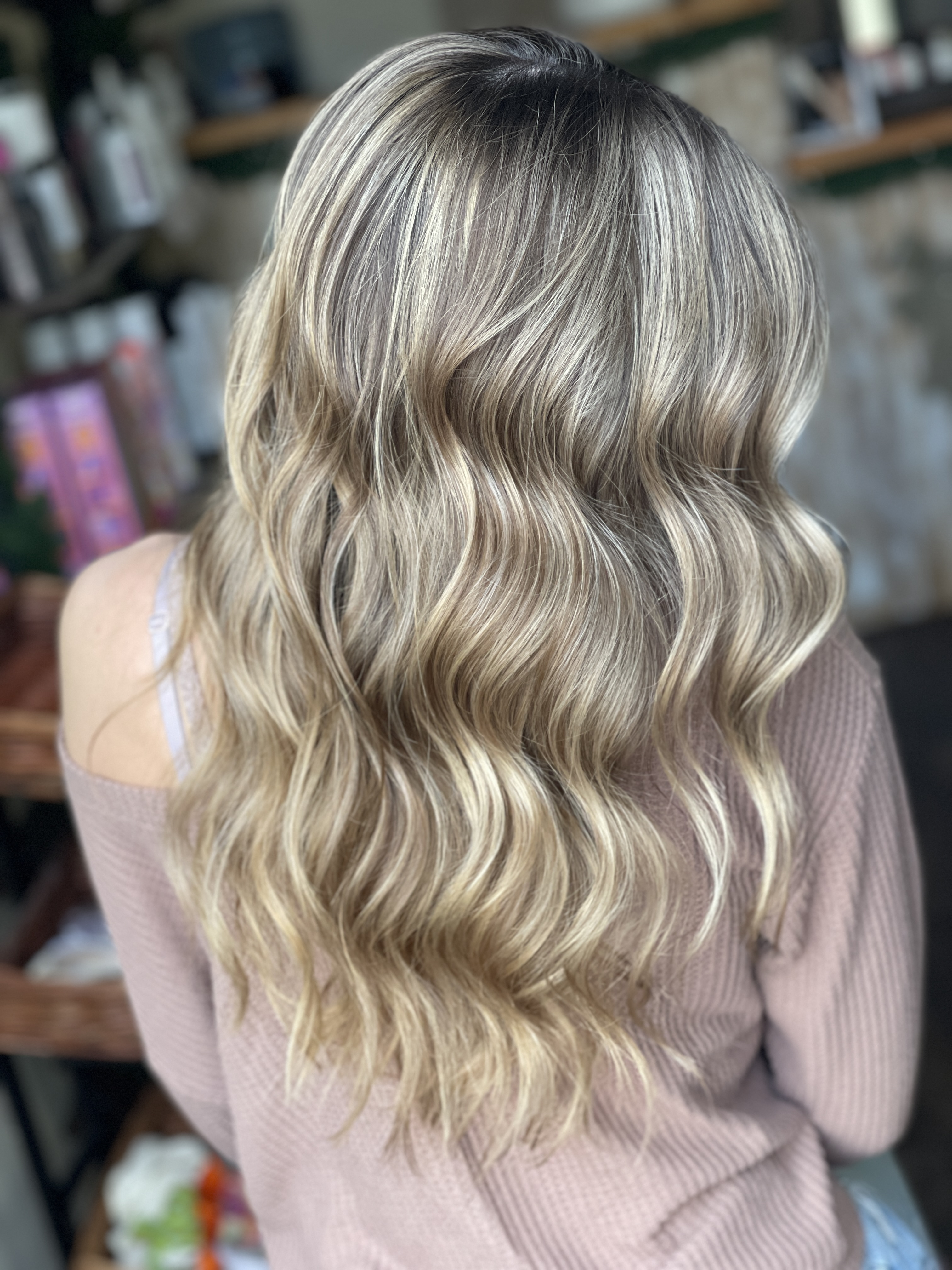 Before and after Brazilian Blowout — curly hair smoothed at Beauty & The Balayage