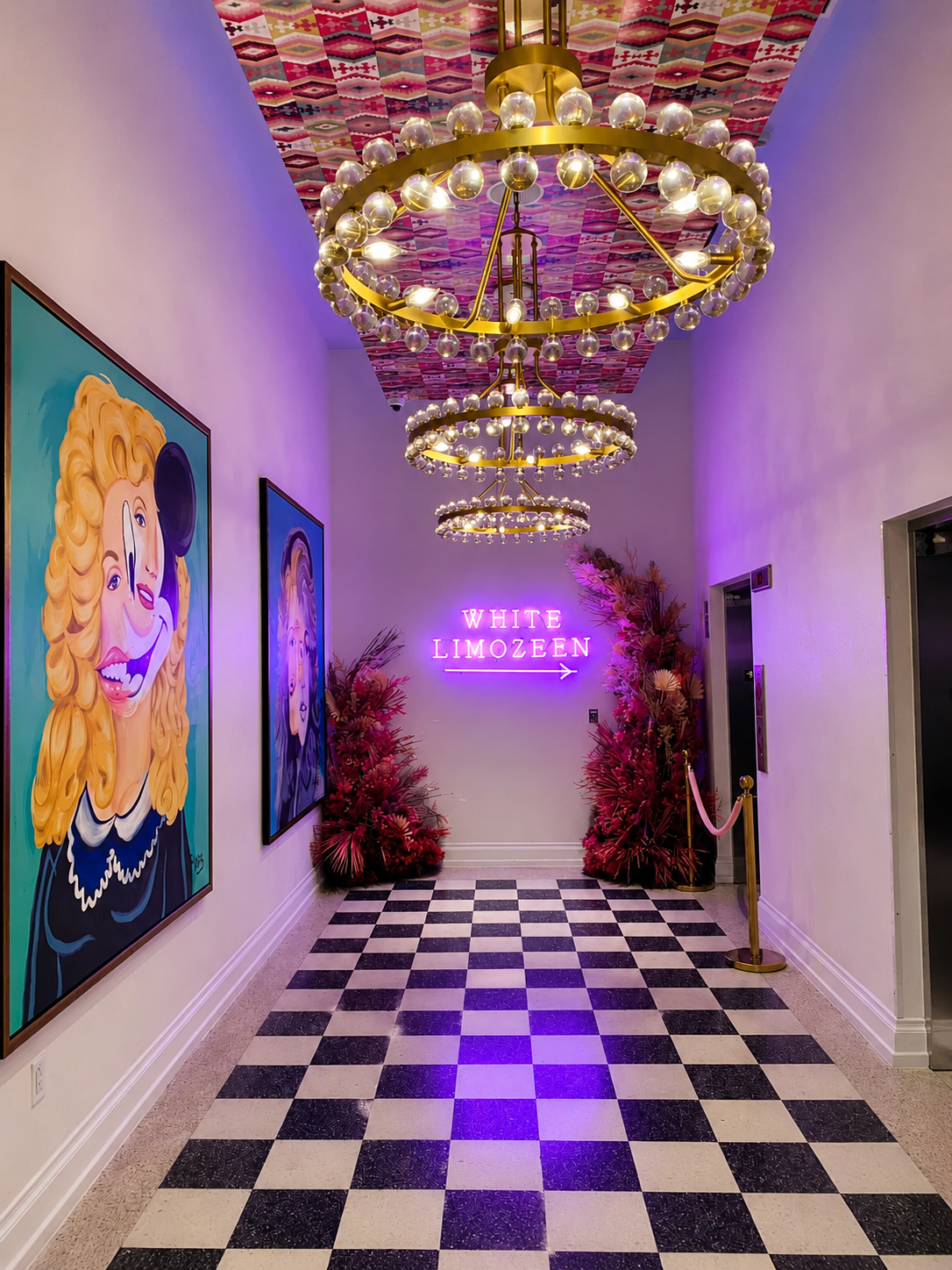 The chandelier-lit gallery hallway at White Limozeen