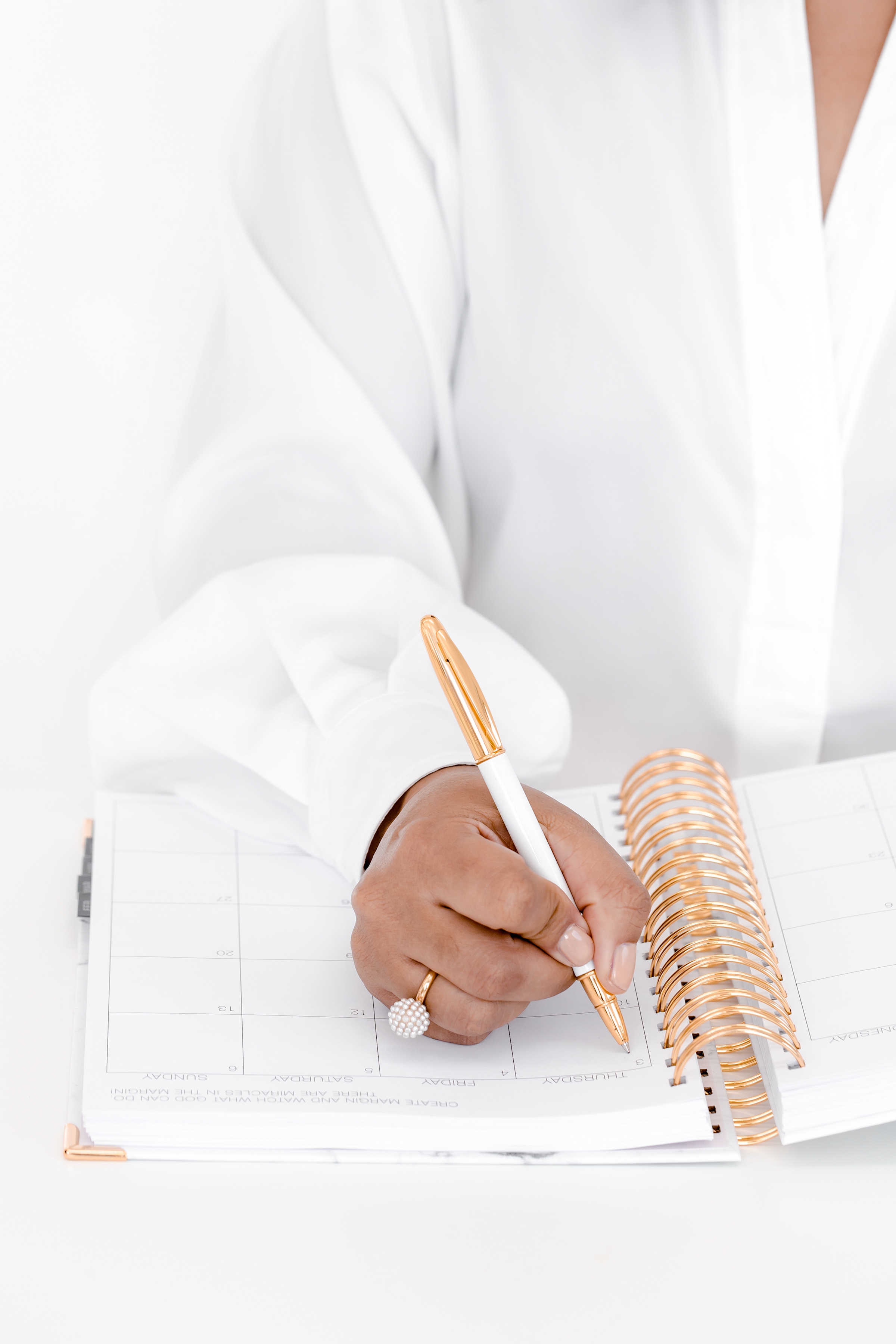 Hand working through strategy on paper