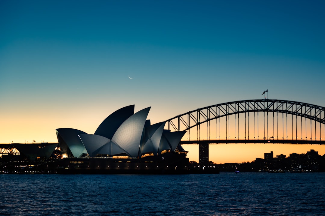 Sydney Opera House and Harbour Bridge at sunset featured in the 2026 guide to moving money from New Zealand to Australia