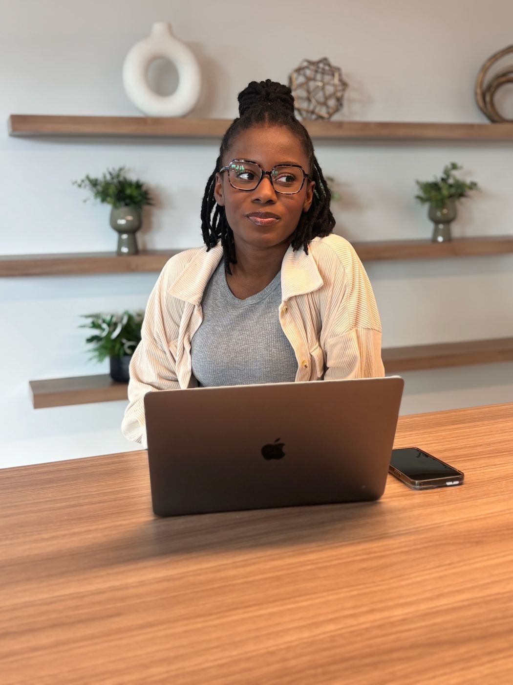 Wildiah Edouard at her laptop, thinking through a project plan