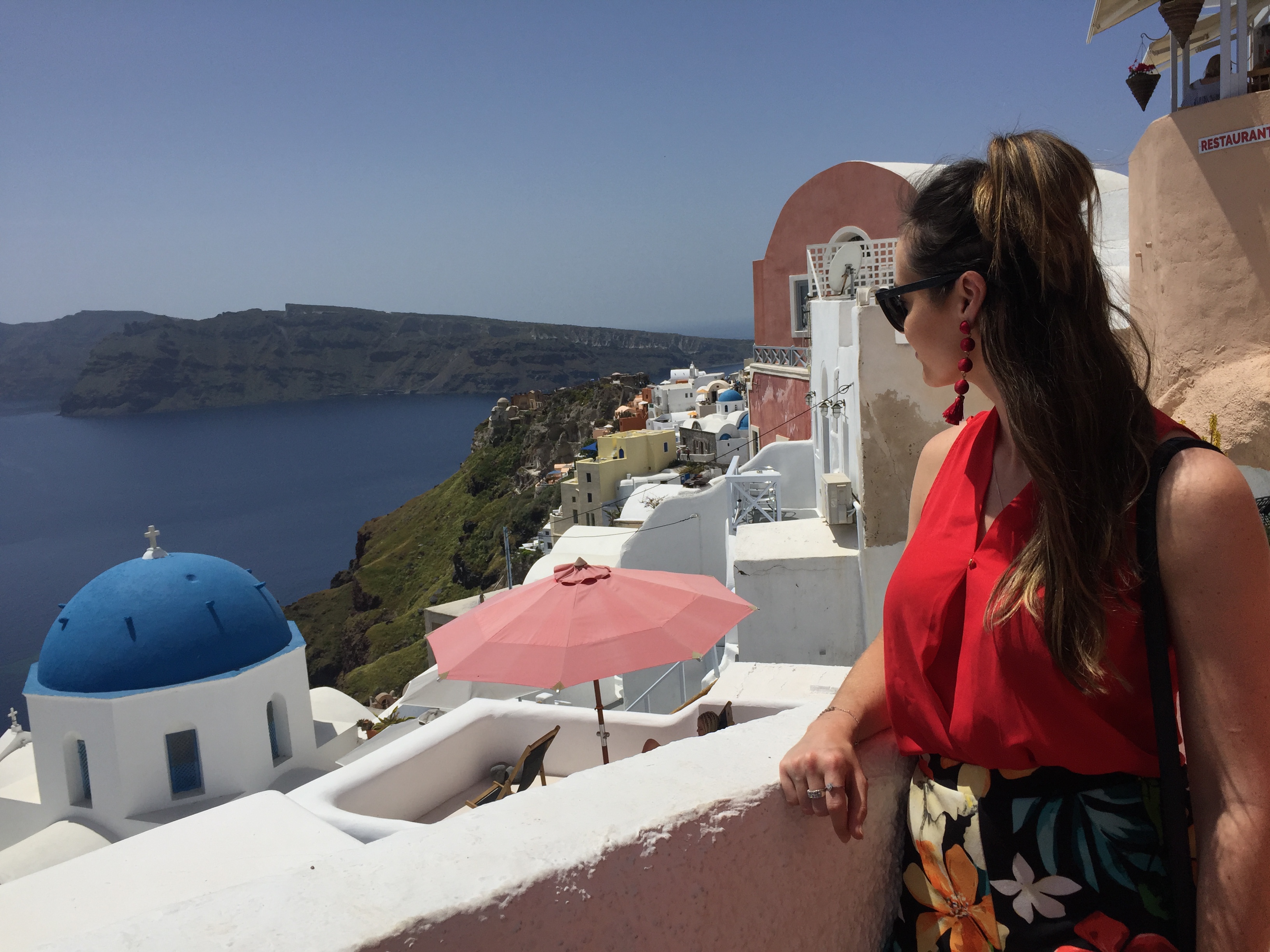 Santorini rooftops, how to see the world, how to work abroad, me looking over the Santorini island Santorini rooftops, how to see the world, how to work abroad, me looking over the Santorini island