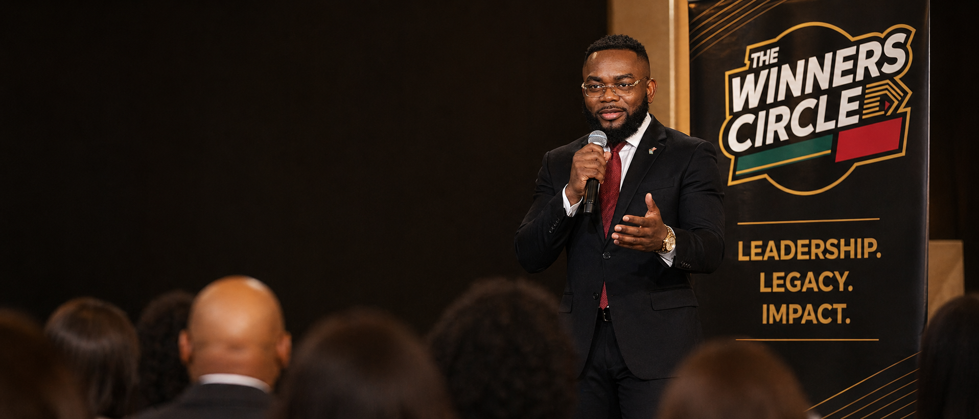 Jay Adewole addressing a live audience