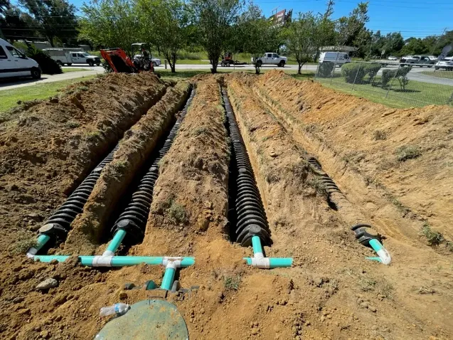 Septic tank access lid and drain field piping installed by R&K Plumbing in Pensacola, FL