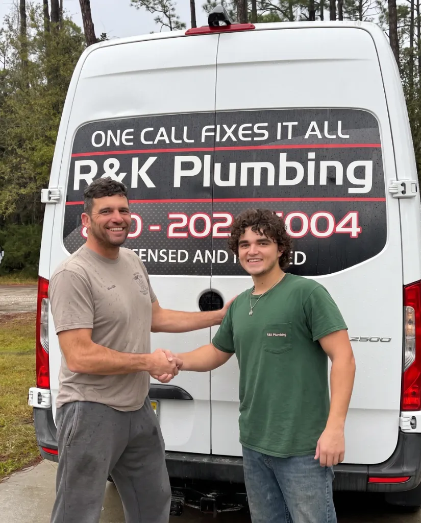R&K Plumbing technician shaking hands with a customer in Pensacola, FL