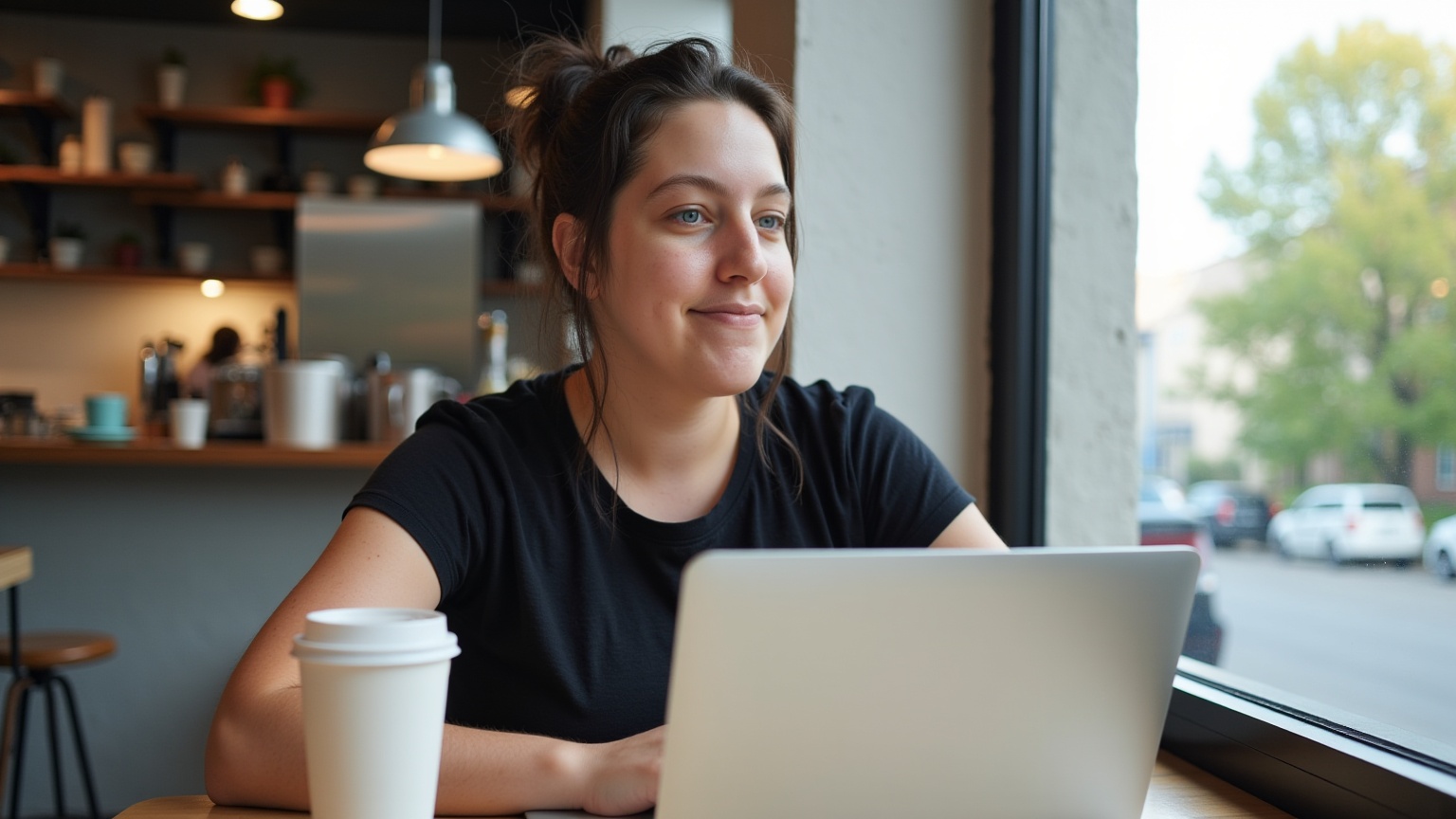 Mom working in a coffee shop wearing the tee