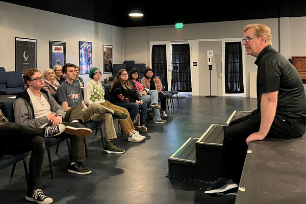 Students collaborating on a digital media project in a JDS Creative Academy classroom