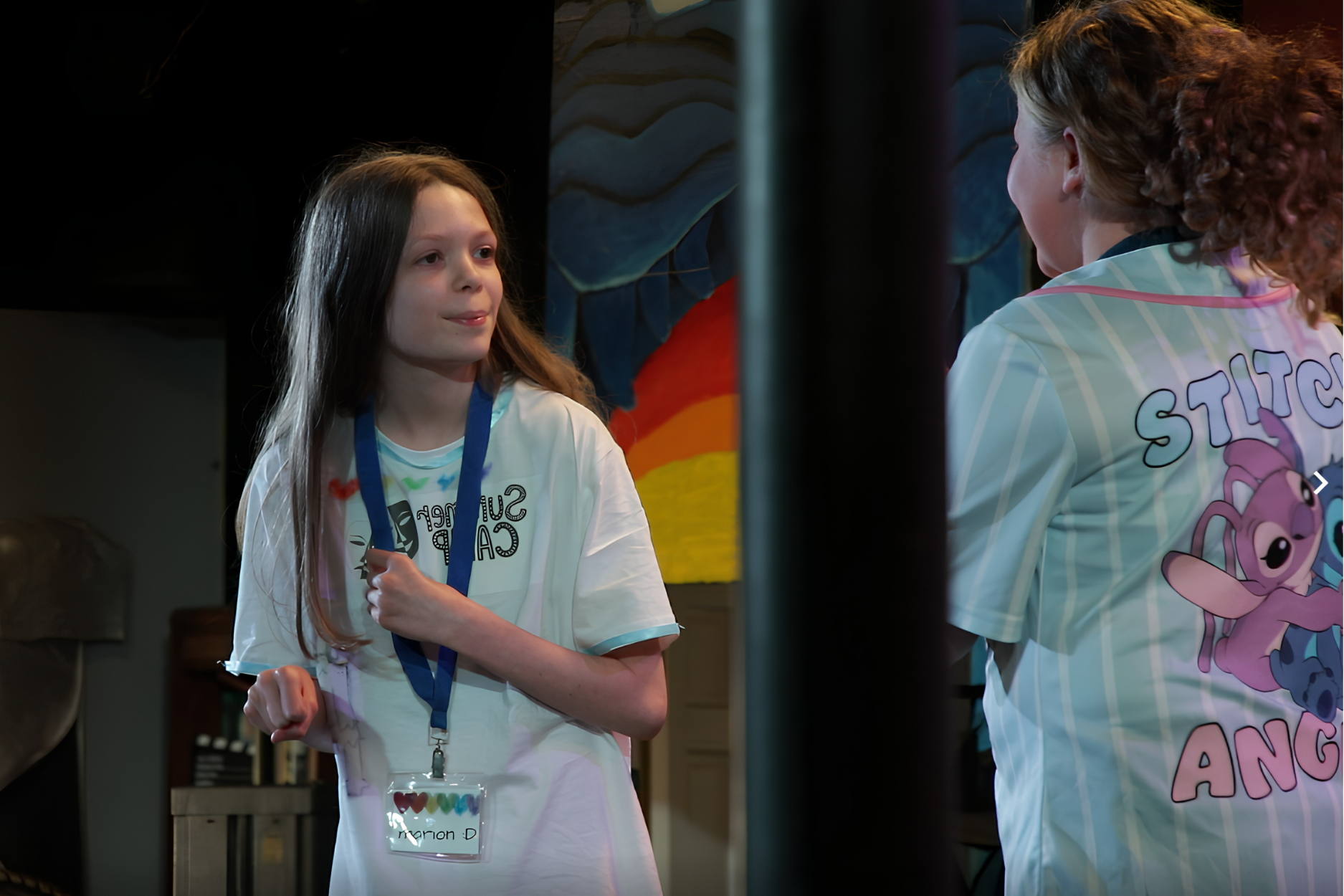 Students collaborating in a summer arts camp, exploring filmmaking, performance, and digital media projects in a creative learning environment