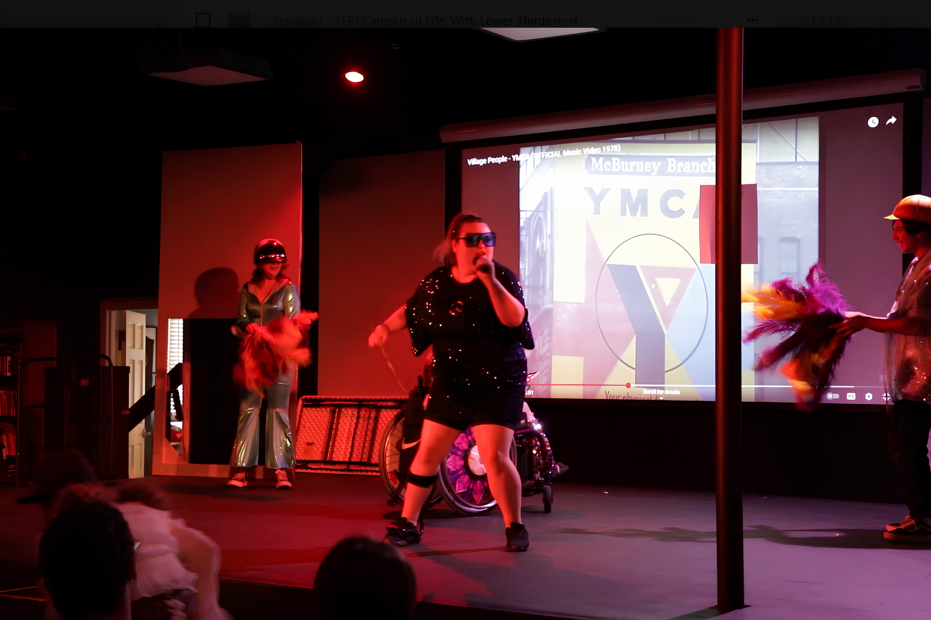 Students collaborating in a summer arts camp, exploring filmmaking, performance, and digital media projects in a creative learning environment