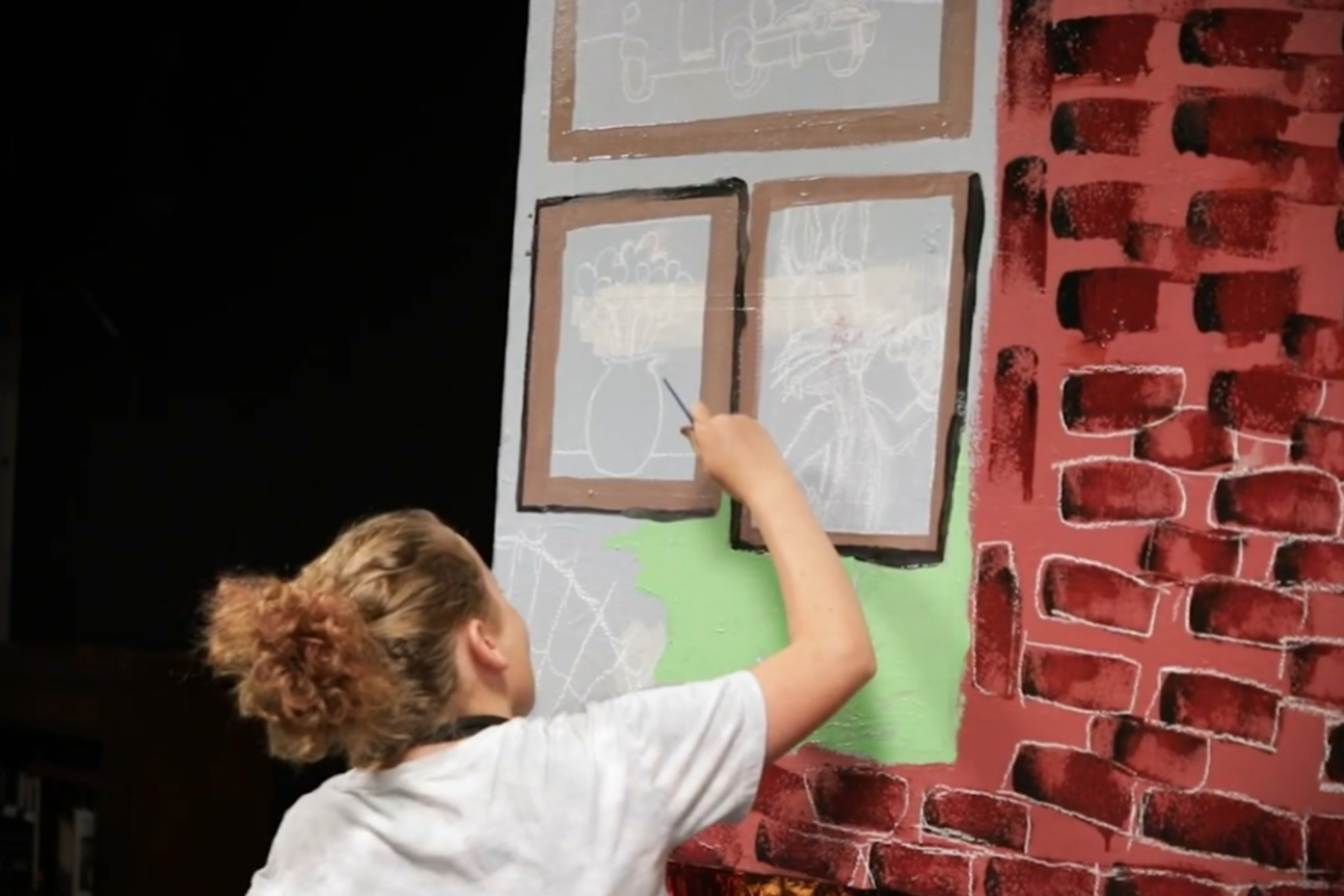 Children participating in a creative summer camp at JDS Creative Academy are engaging in storytelling, performance, and digital media activities
