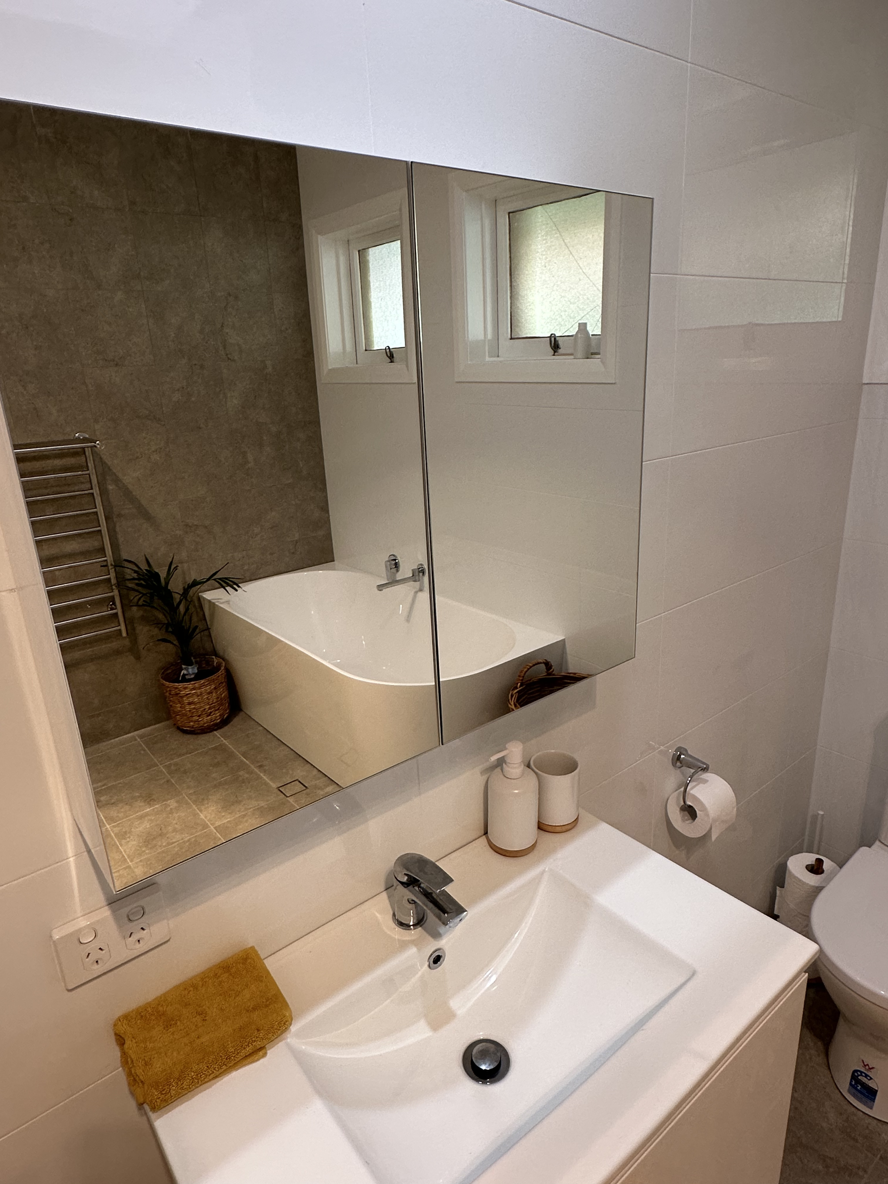 Large grey wall tiles and neat grout detailing in the Dubbo bathroom