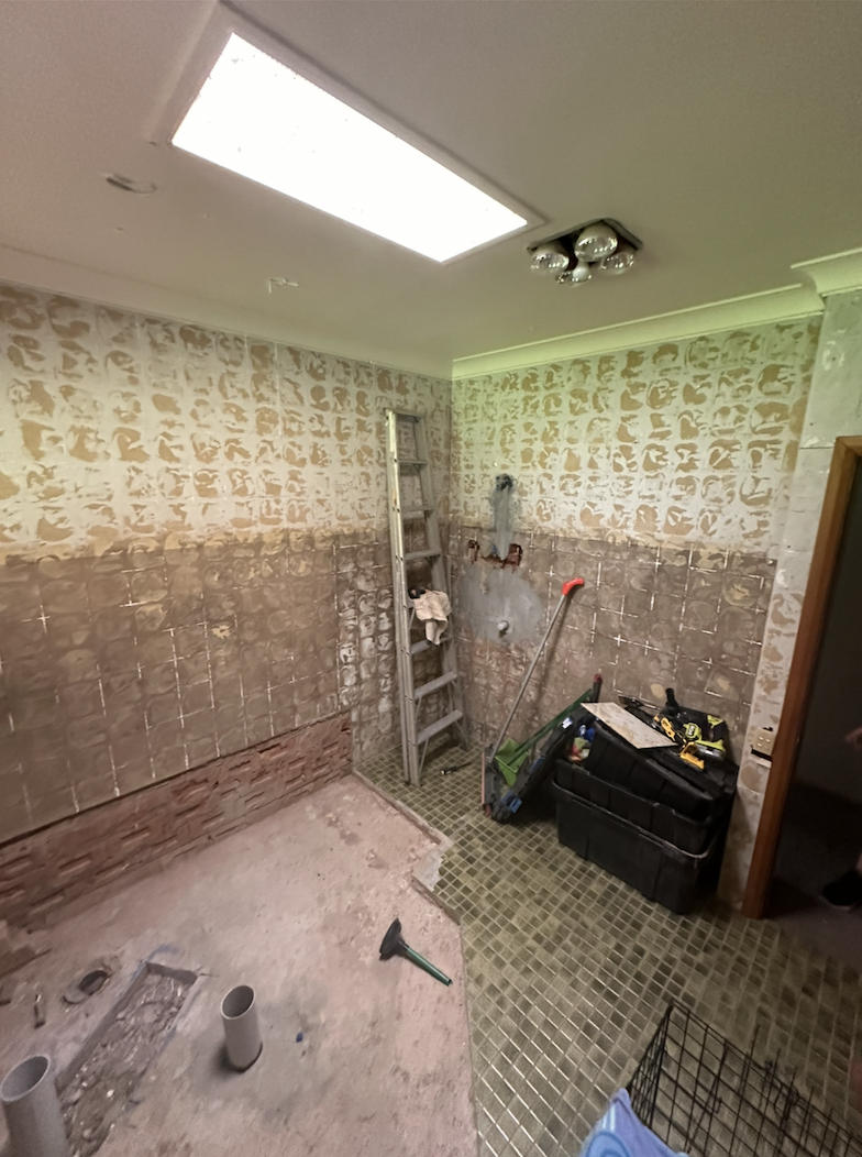 Glass shower enclosure with heated towel rail in the Dubbo bathroom