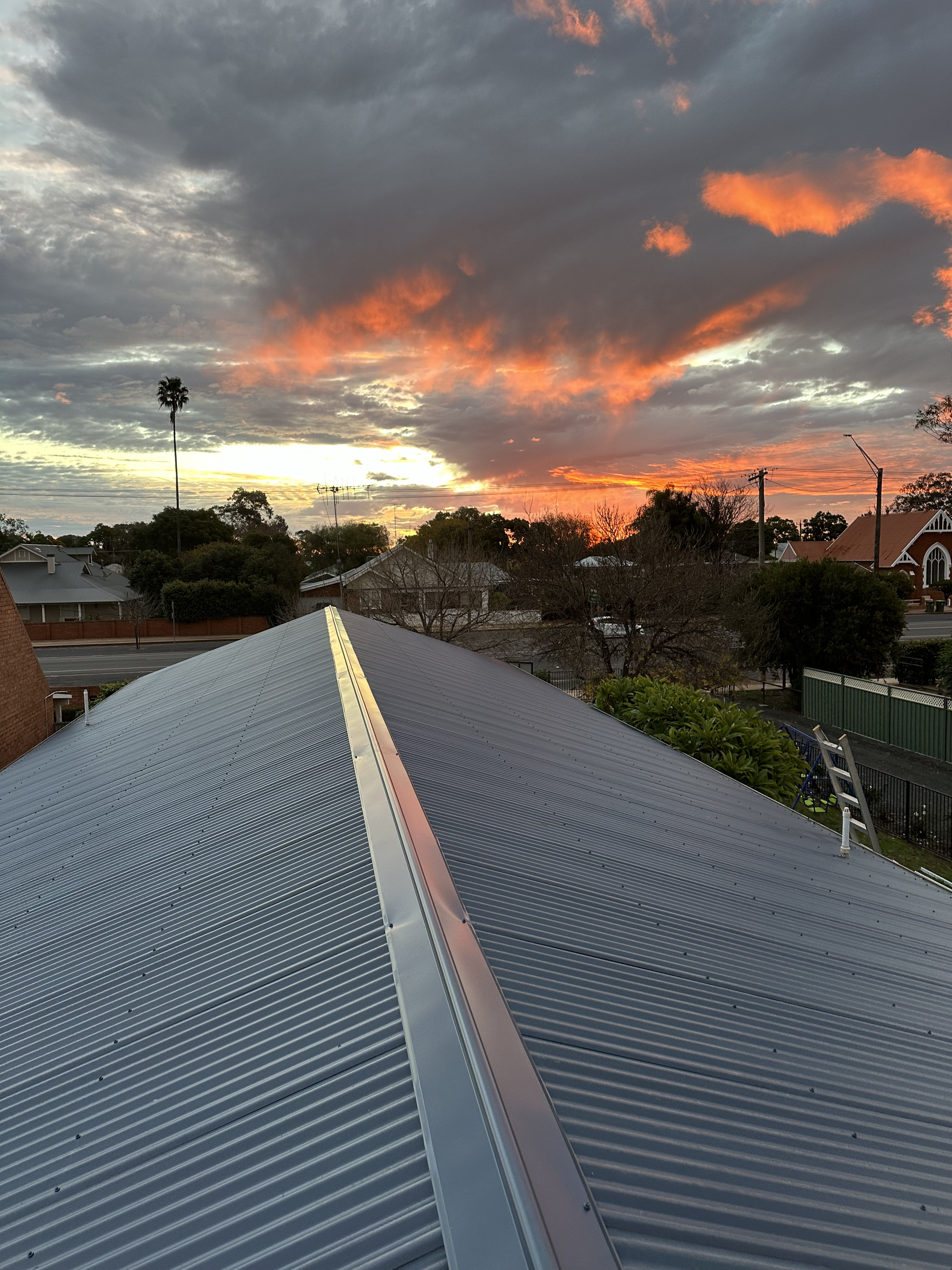 Newly fitted metal roof with finished gutters and flashing on a Narromine home