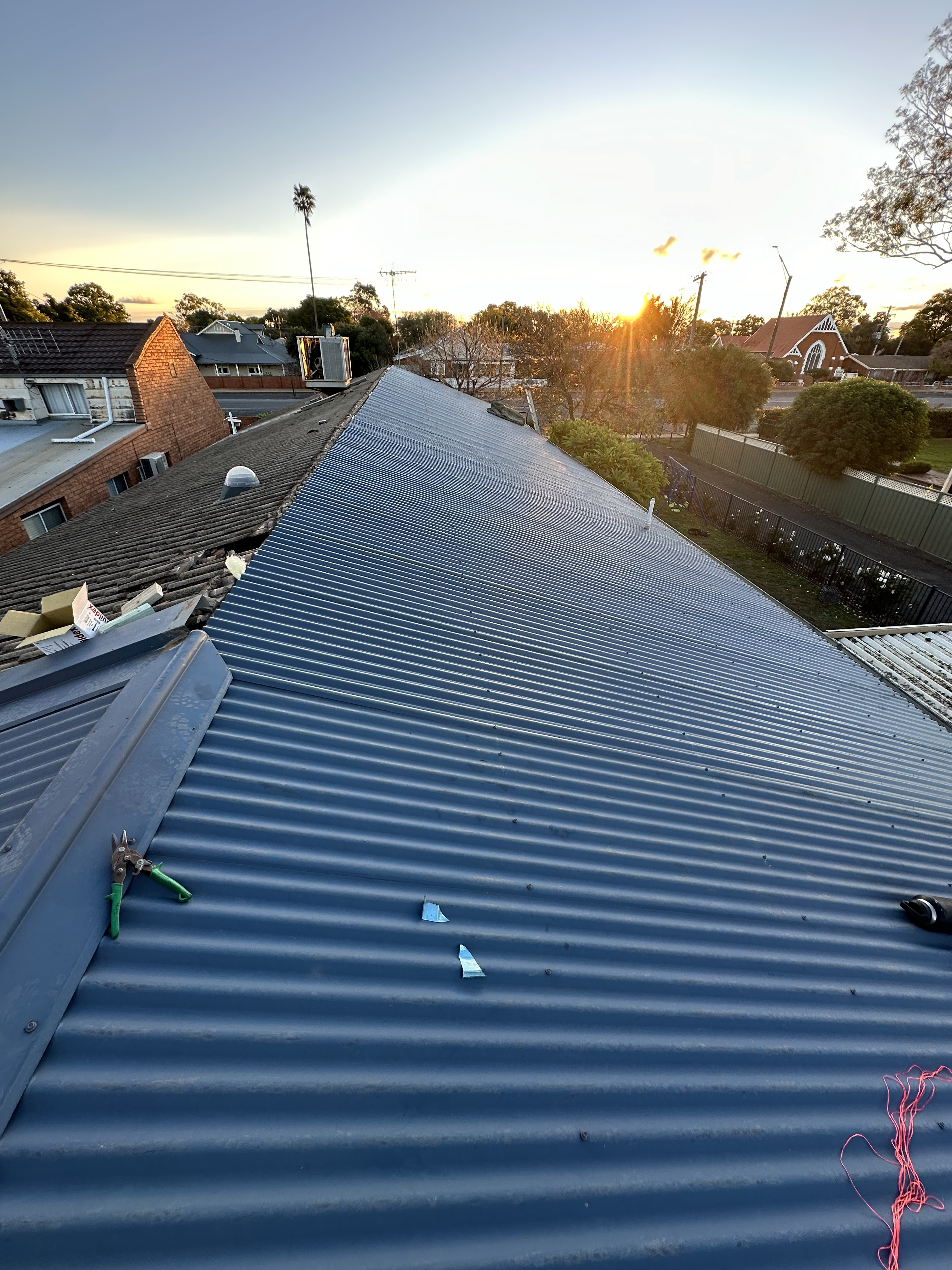 Crisp metal roof sheeting laid in clean rows on the Narromine roof