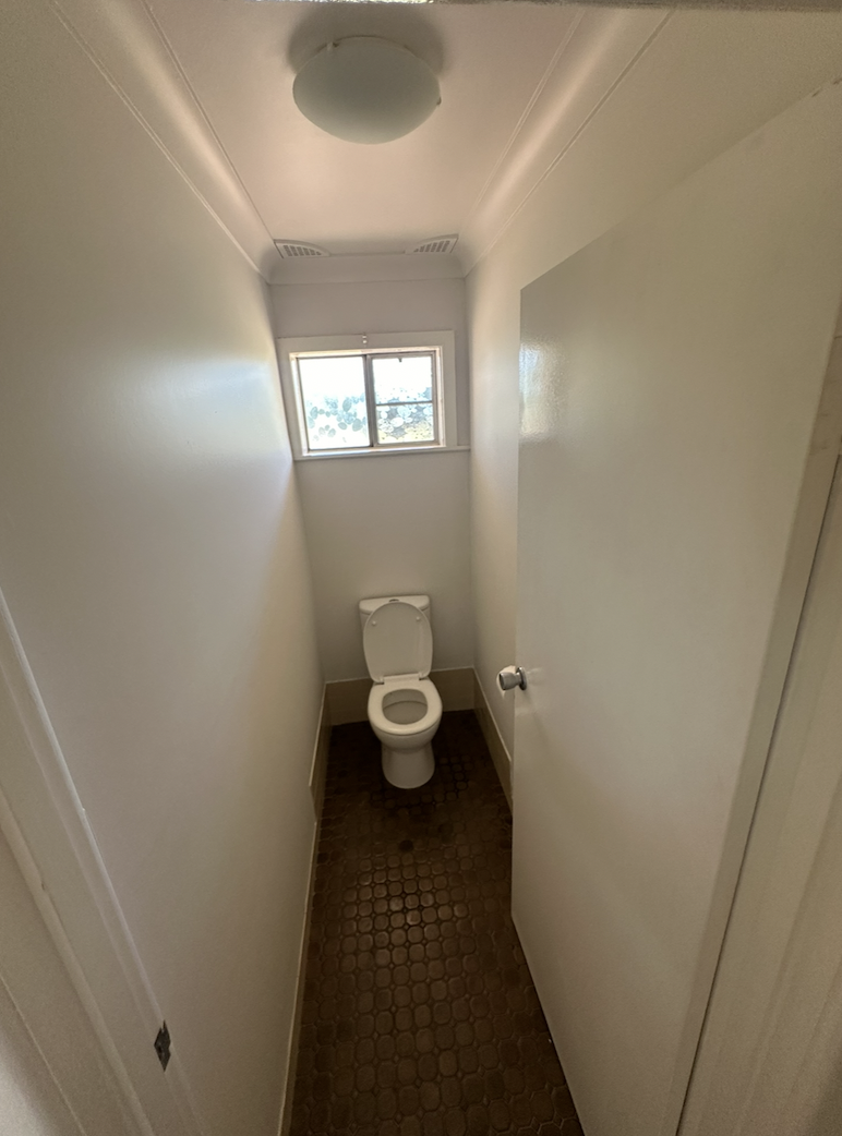 Wide shot of the bright, contemporary bathroom layout in Trangie