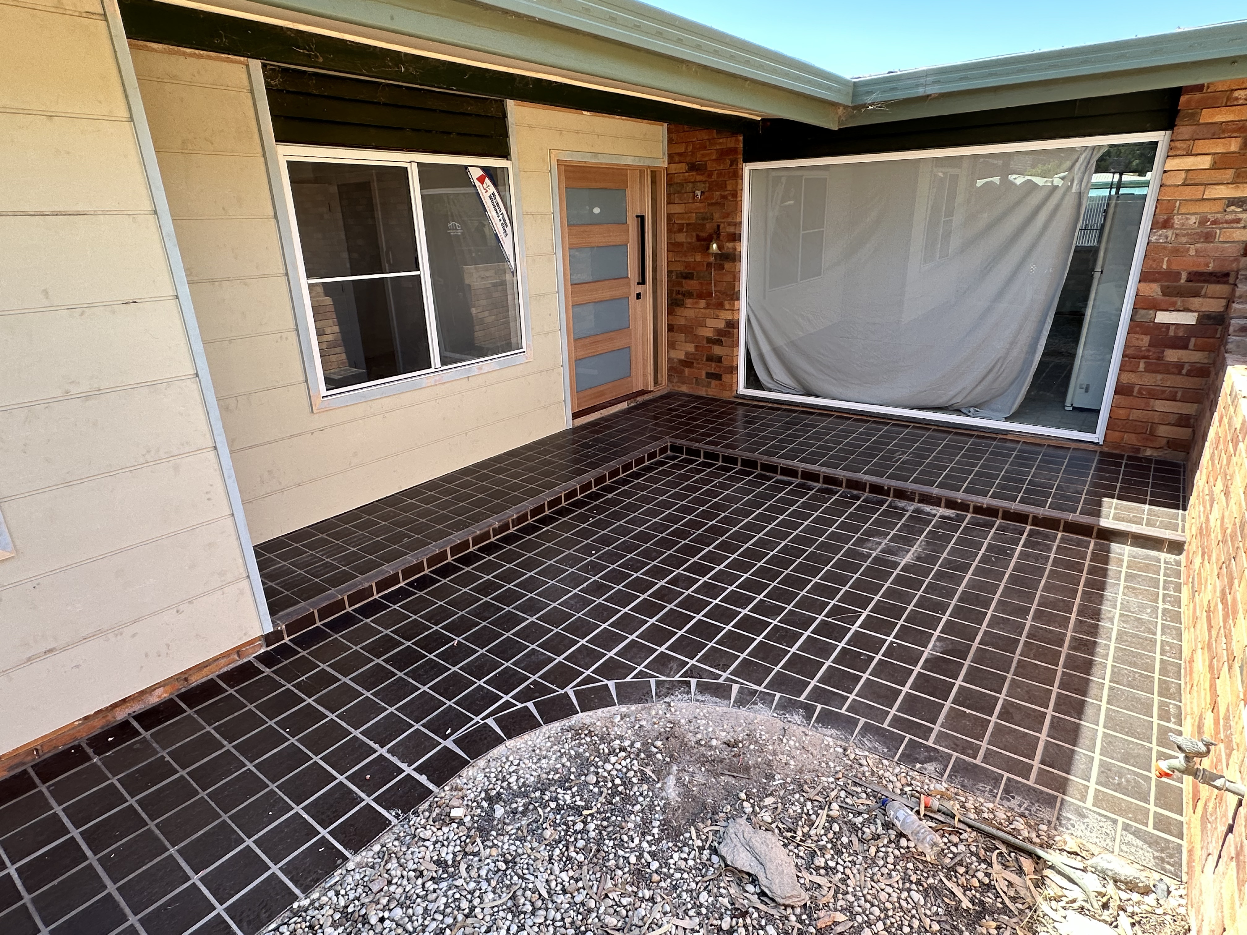 Angled view of the freshly clad exterior wall in Trangie