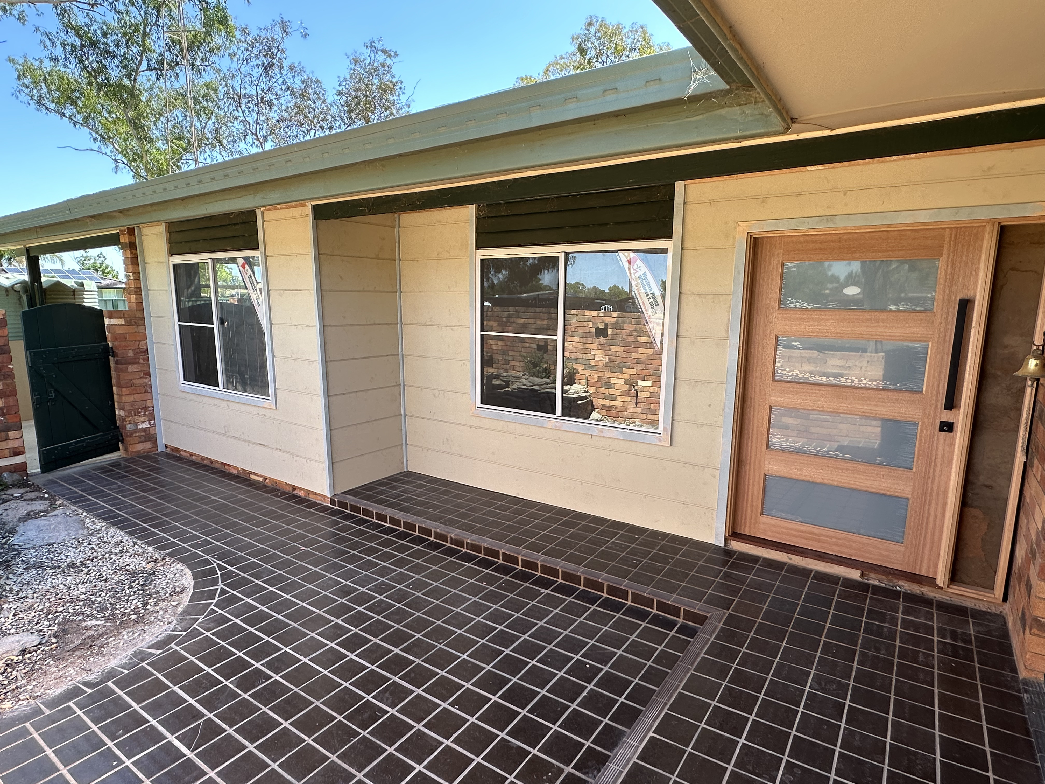 Fresh exterior cladding installed across the front of a Trangie home