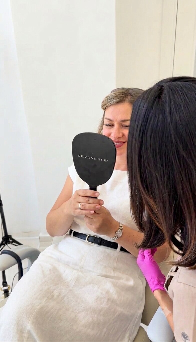 Patient checking the result in the mirror, Amelia Clinic
