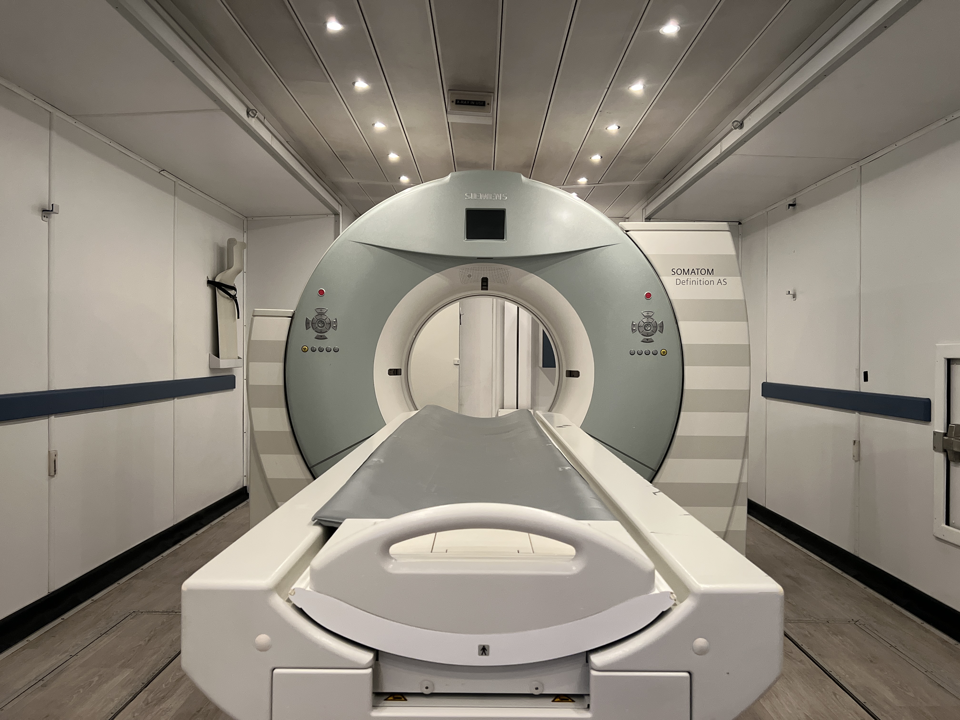 Siemens SOMATOM Definition AS scanner and patient table inside an Atlas CT trailer.