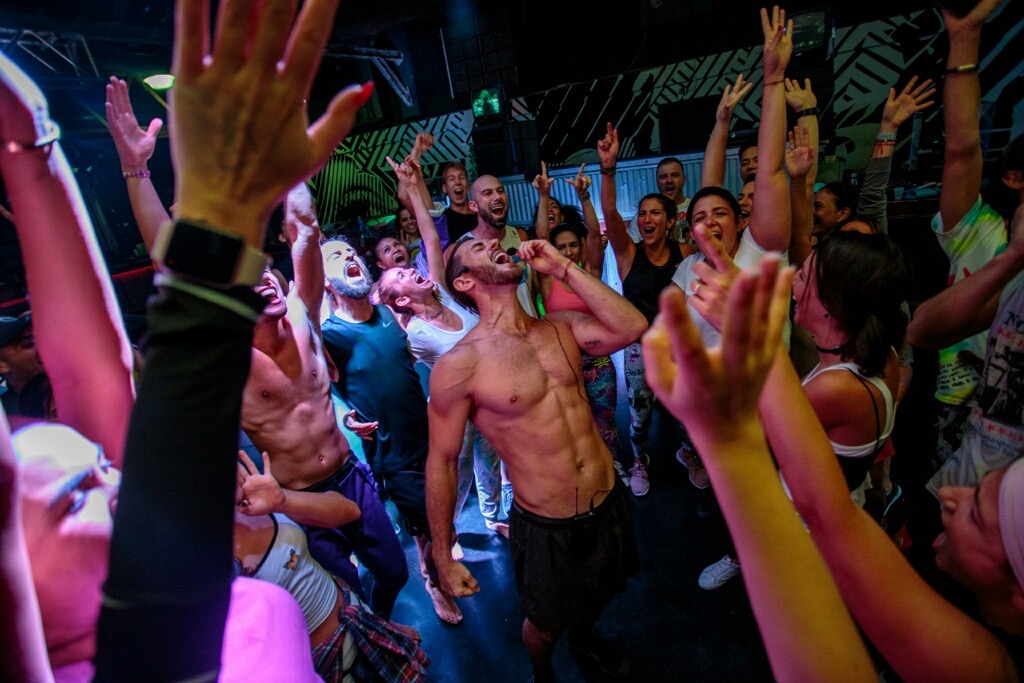 Ecstatic dance, hands raised