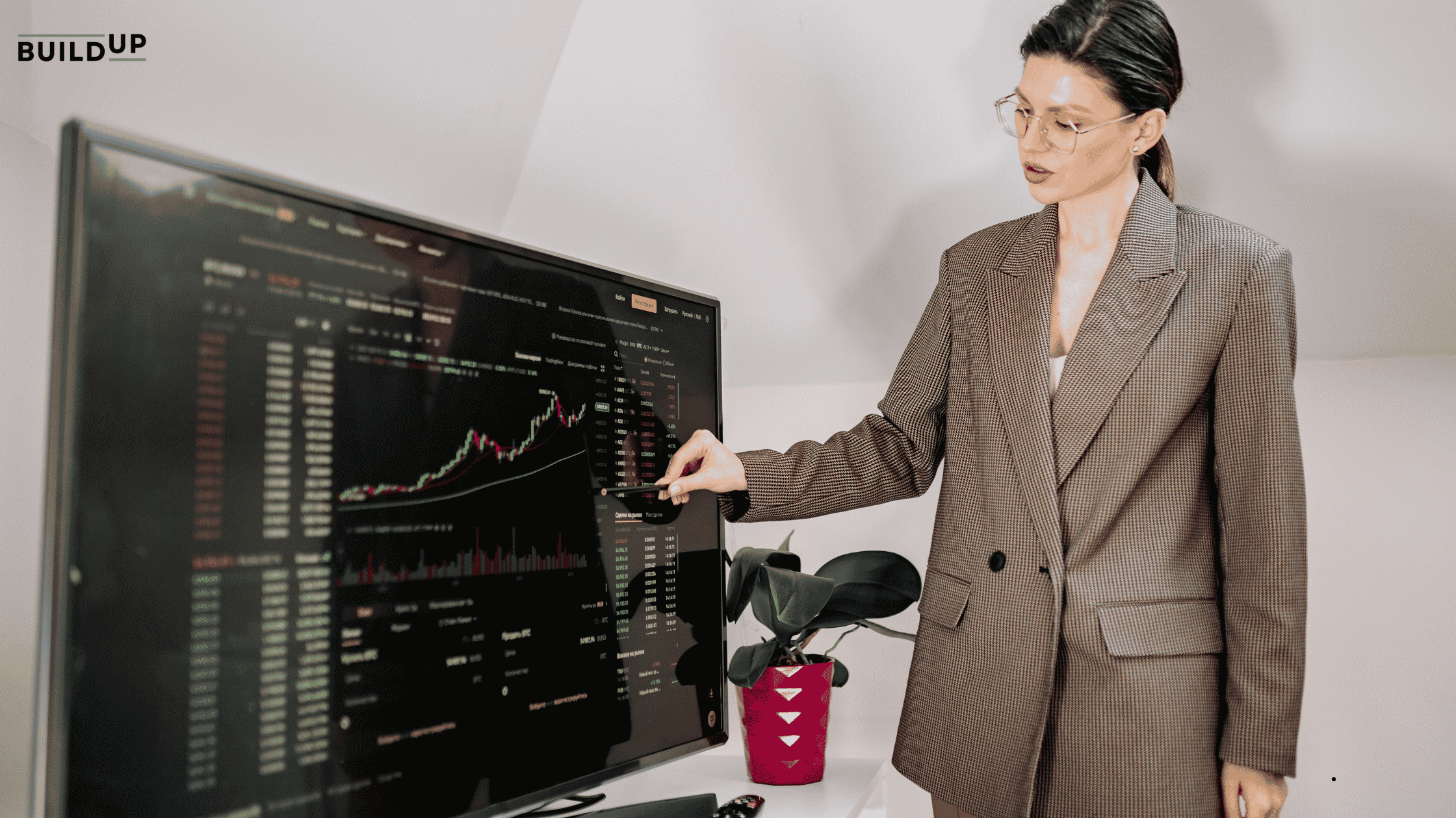 A business owner presenting her competitor analysis report from the monitor